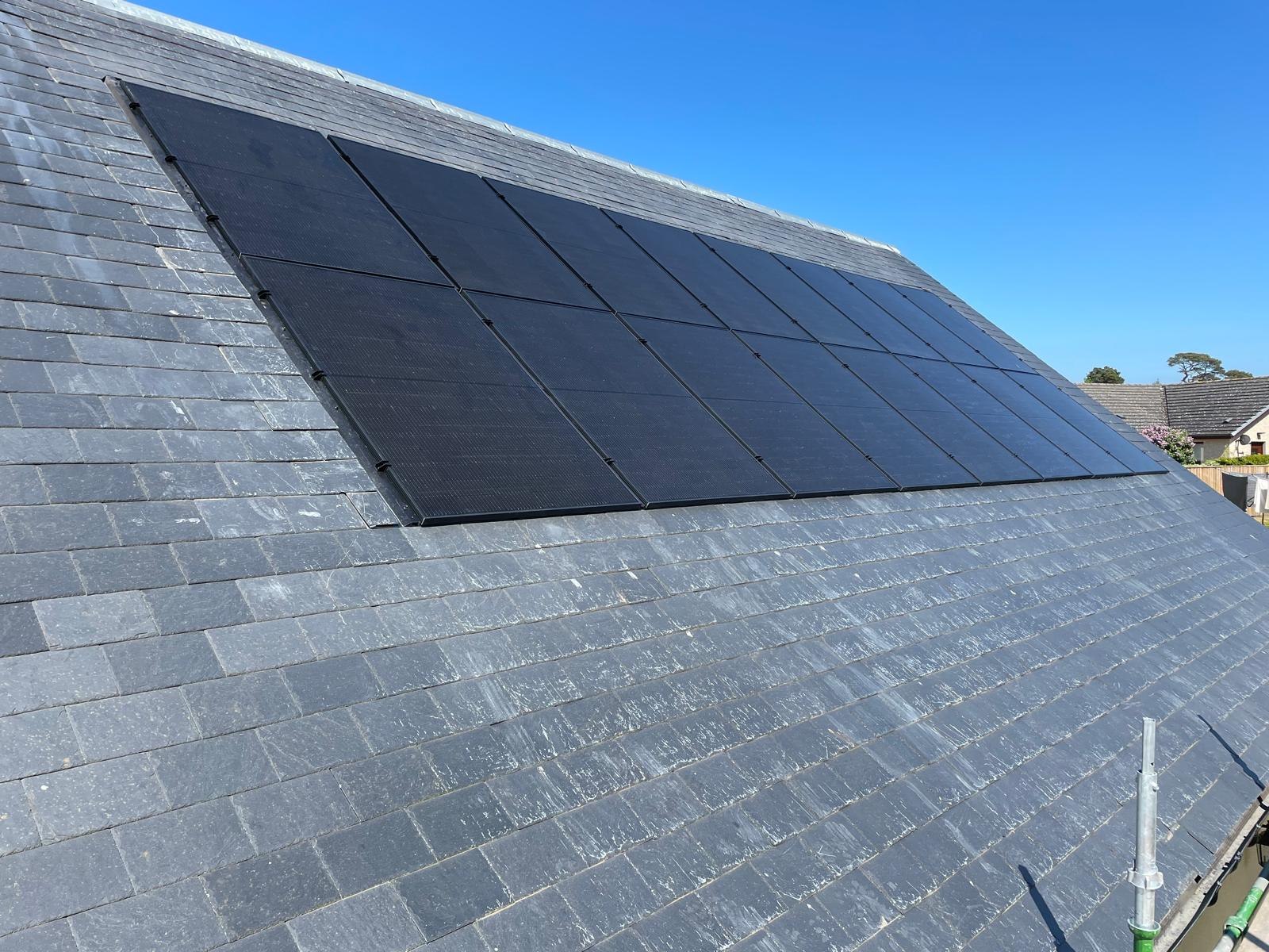 Solar PV array installed across a pitched slate roof