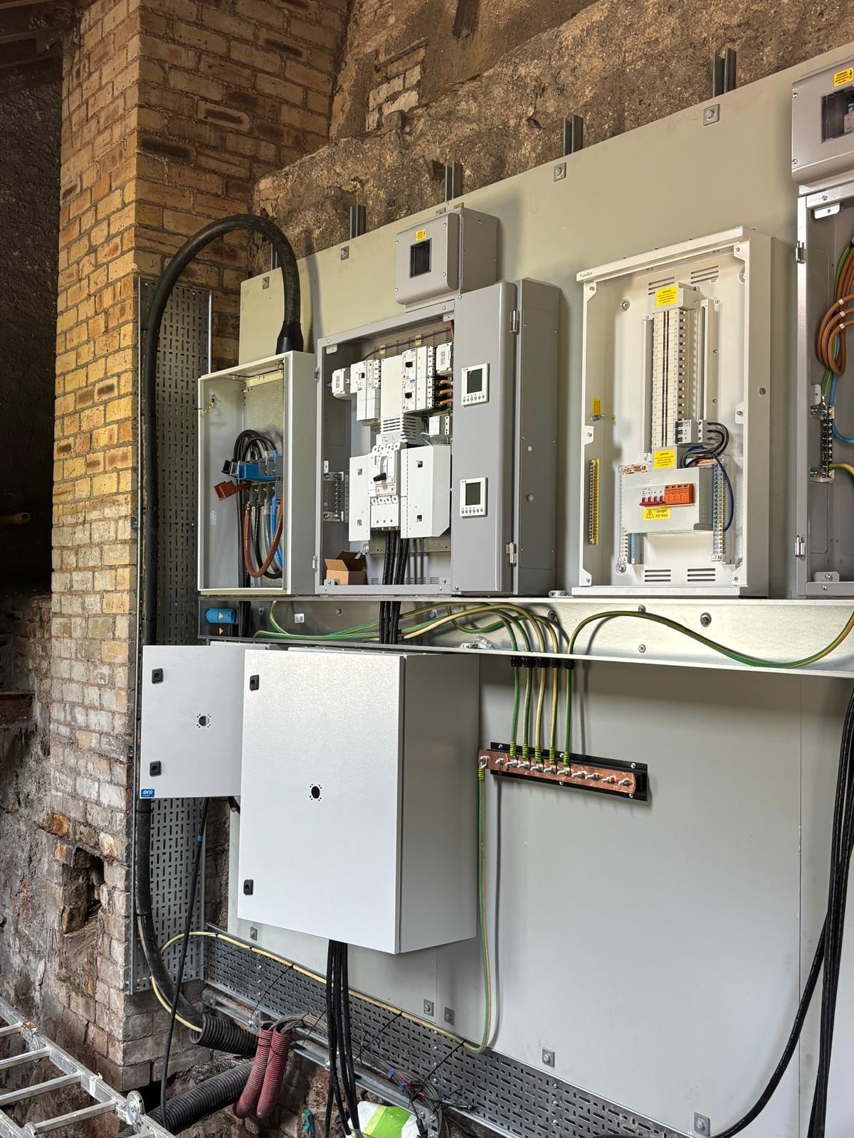 Three-phase distribution equipment installed in a commercial stone building