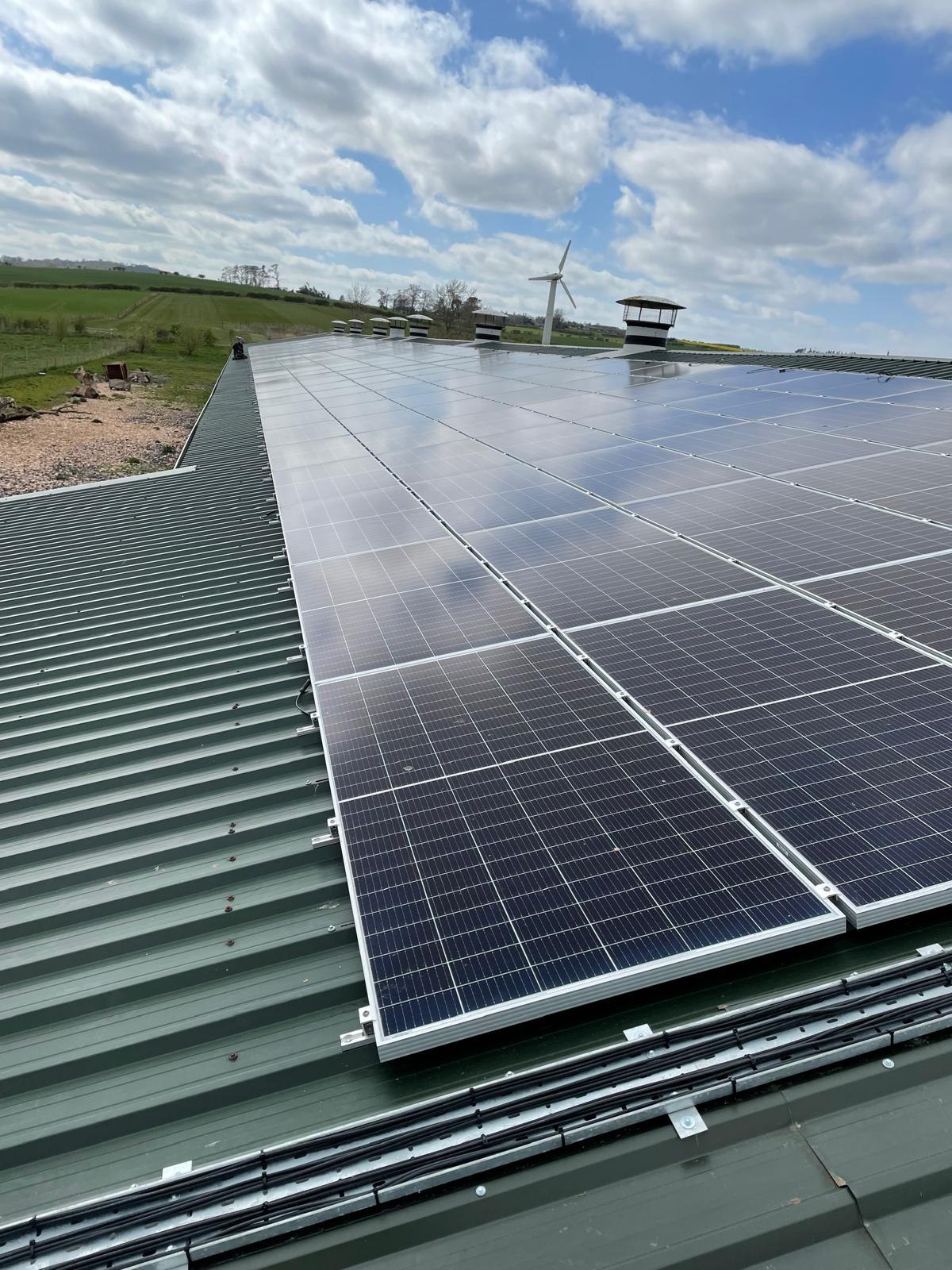 Large solar PV array on an agricultural shed roof in the Borders