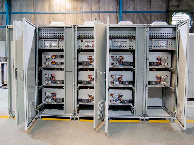 Power Factor Correction: power factor correction cabinets with capacitor stages open for commissioning