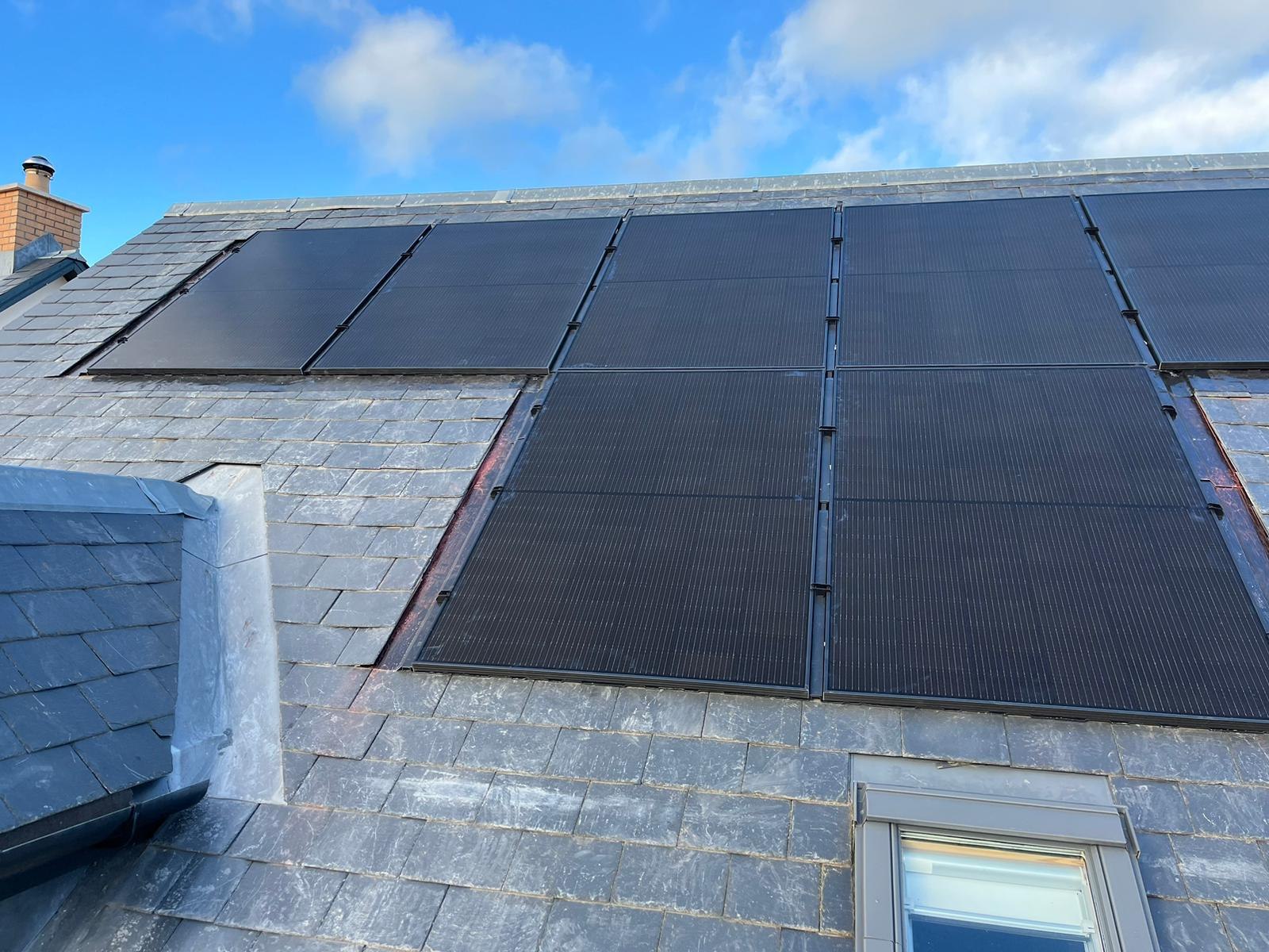 Black solar PV panels installed on a slate roof by MCS certified installers