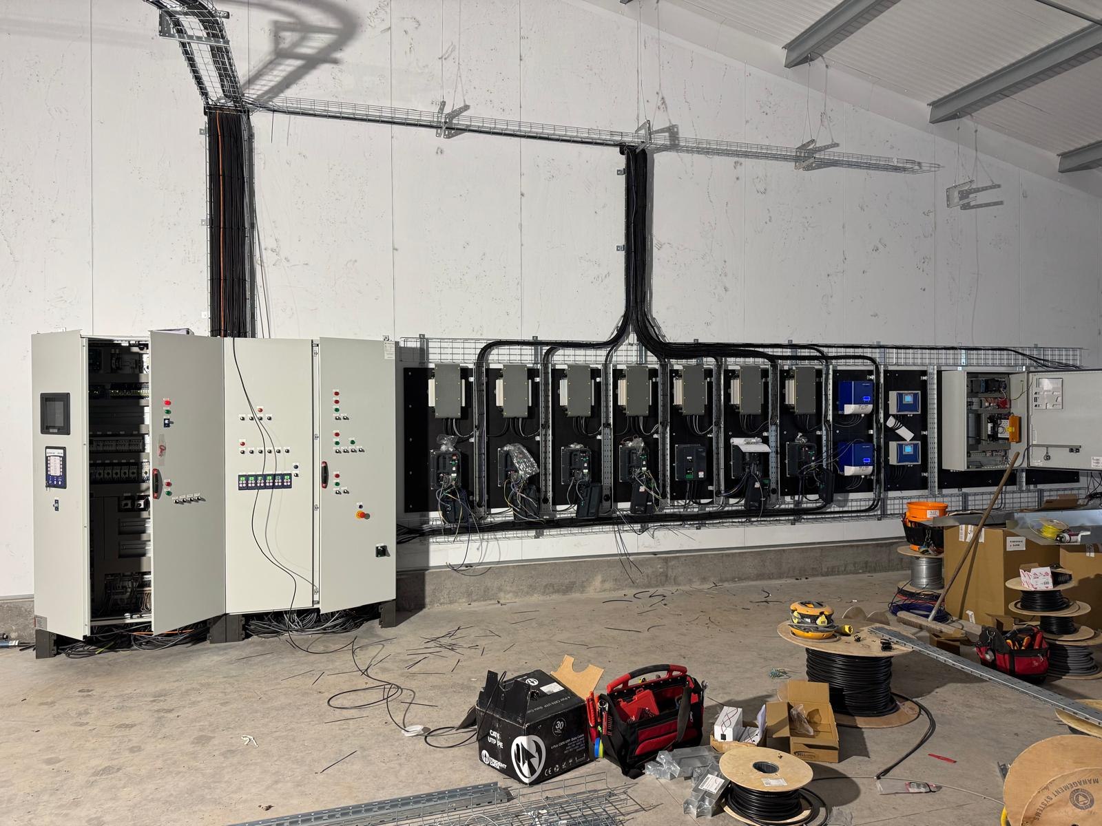 Industrial control panels and cable containment installed in a commercial unit