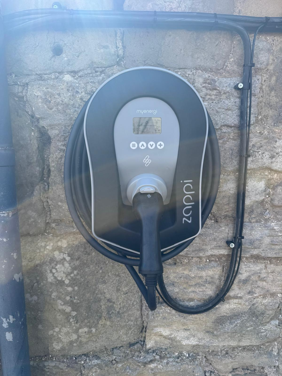 Zappi EV charge point installed on a stone wall at a Borders home