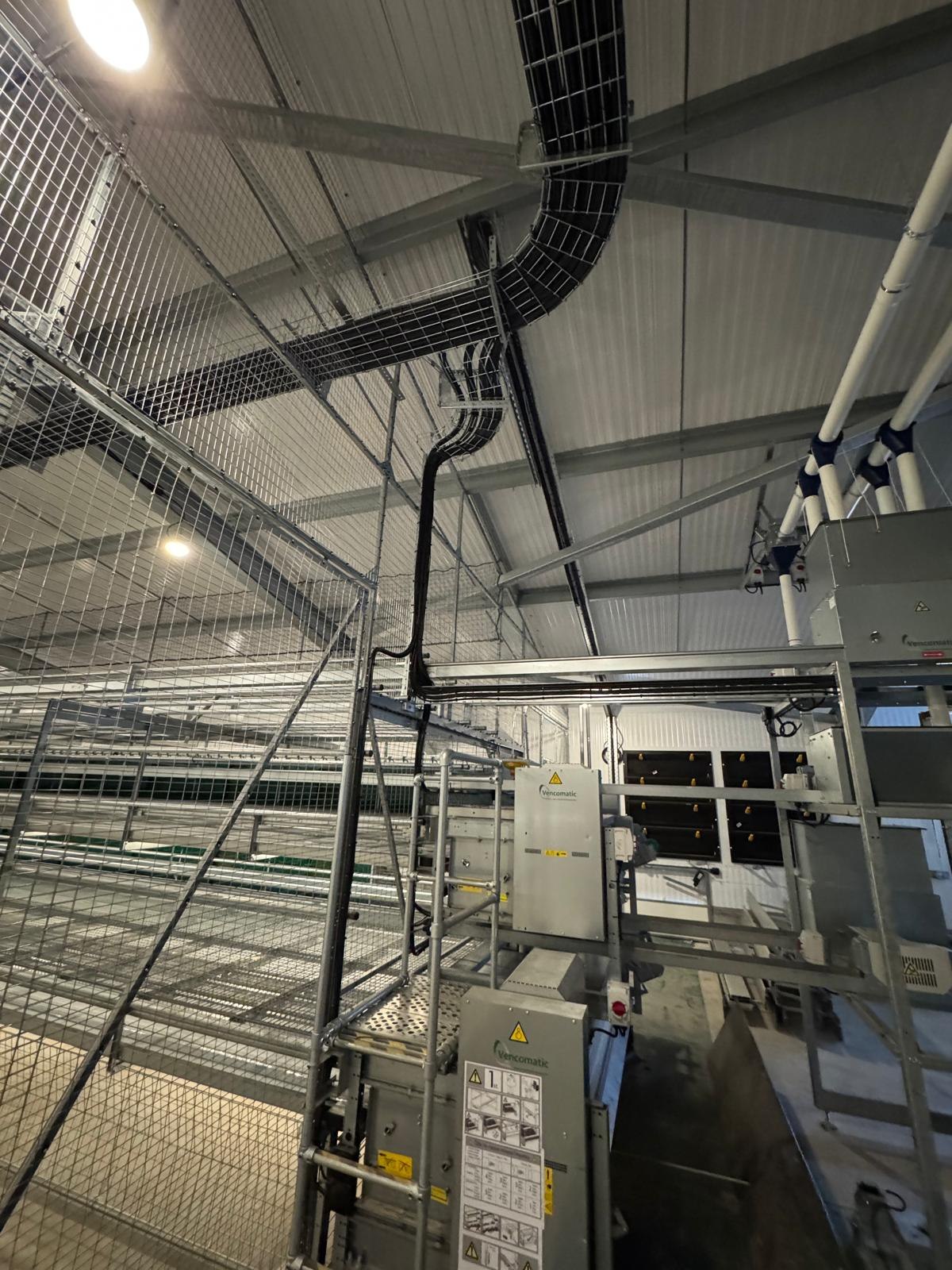 Cable tray and machinery control gear inside an agricultural building